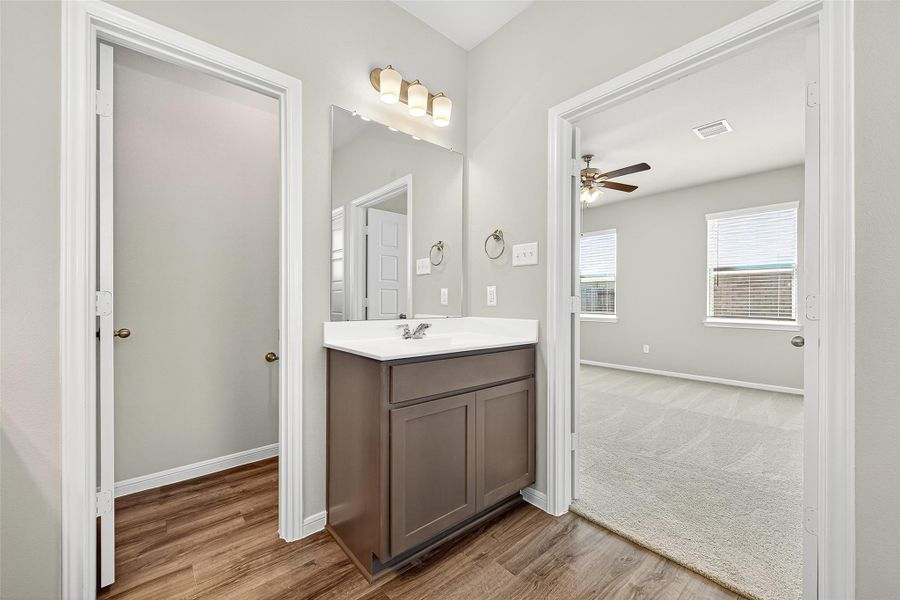 Furnished interior view inside a new home in Sunterra, Katy (Image 11).