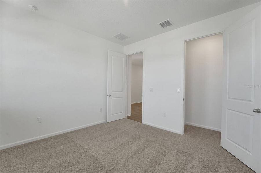 Spacious, unfurnished interior of a new home in Green Key Village, Lady Lake (Image 35).
