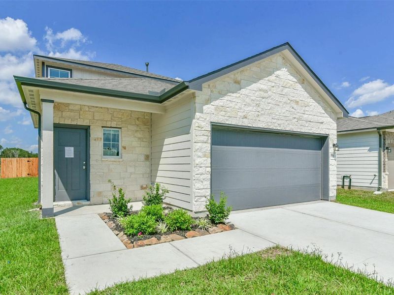 Front exterior of a new home in The Villages at WestPointe, Dayton, TX, highlighting curb appeal (Image 2).