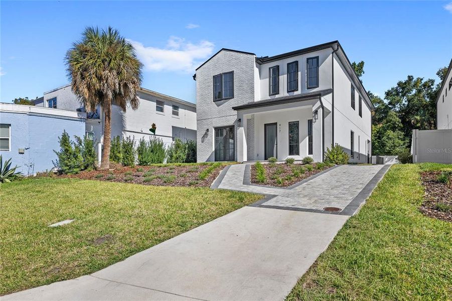 Front exterior of a new home in , Orlando, FL, highlighting curb appeal (Image 1). Front exterior of a new home in , Orlando, FL, highlighting curb appeal (Image 1).