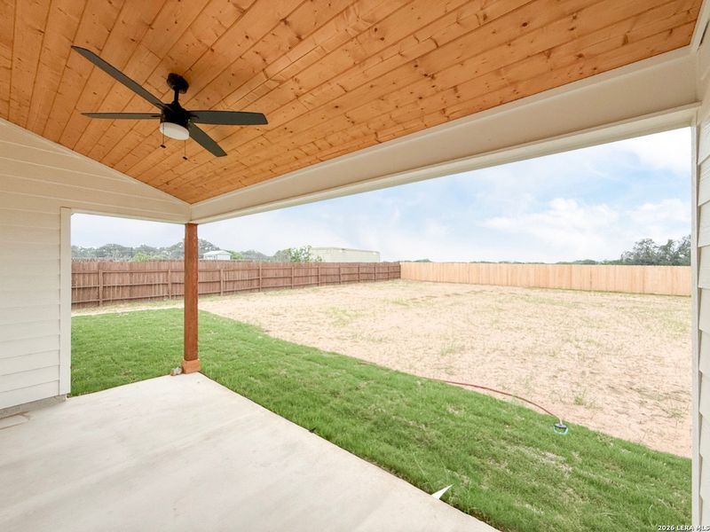 Exterior details and patio area of a home in , Devine (Image 25).