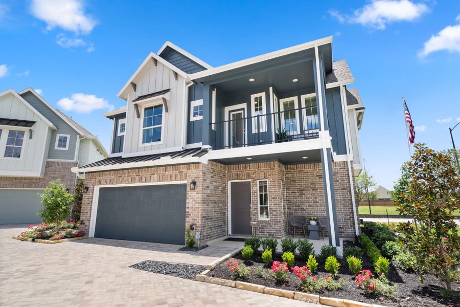 Front exterior of a new home in Elyson, Katy, TX, highlighting curb appeal (Image 17).