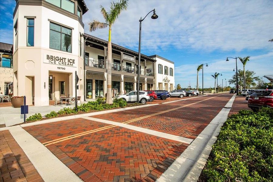 Front exterior of a new home in Sunstone at Wellen Park, Venice, FL, highlighting curb appeal (Image 26).