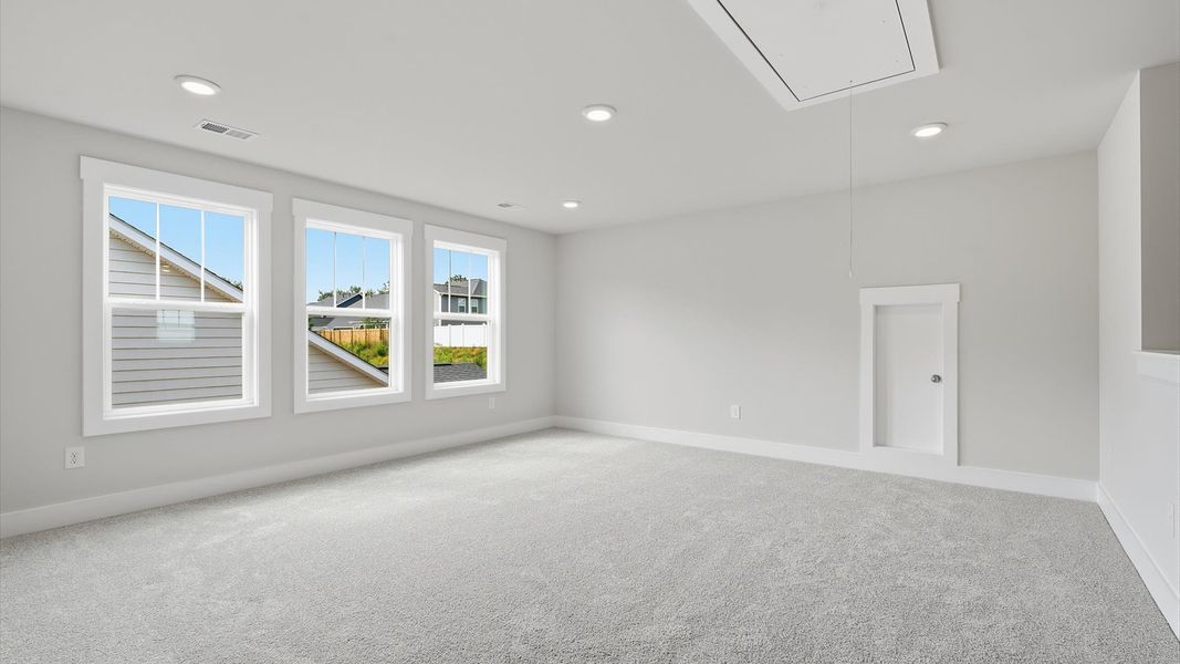 Superior loft space with soft carpet, ideal for work, relaxation, or entertainment