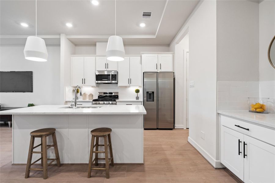 Neutral finishes and Swiss engineered hardwood create a warm, modern foundation.