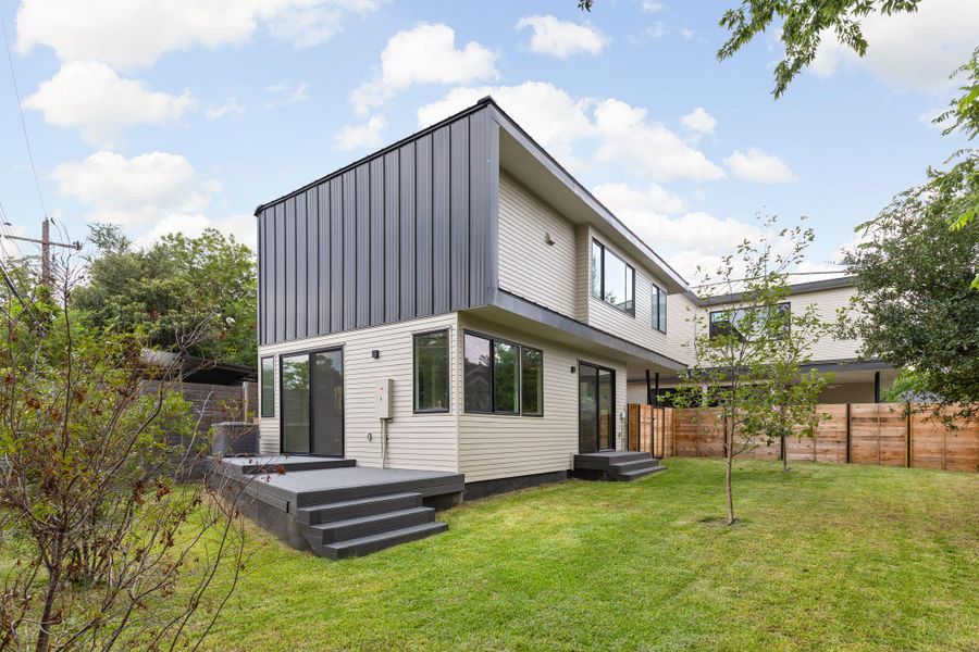 Back of house featuring a deck