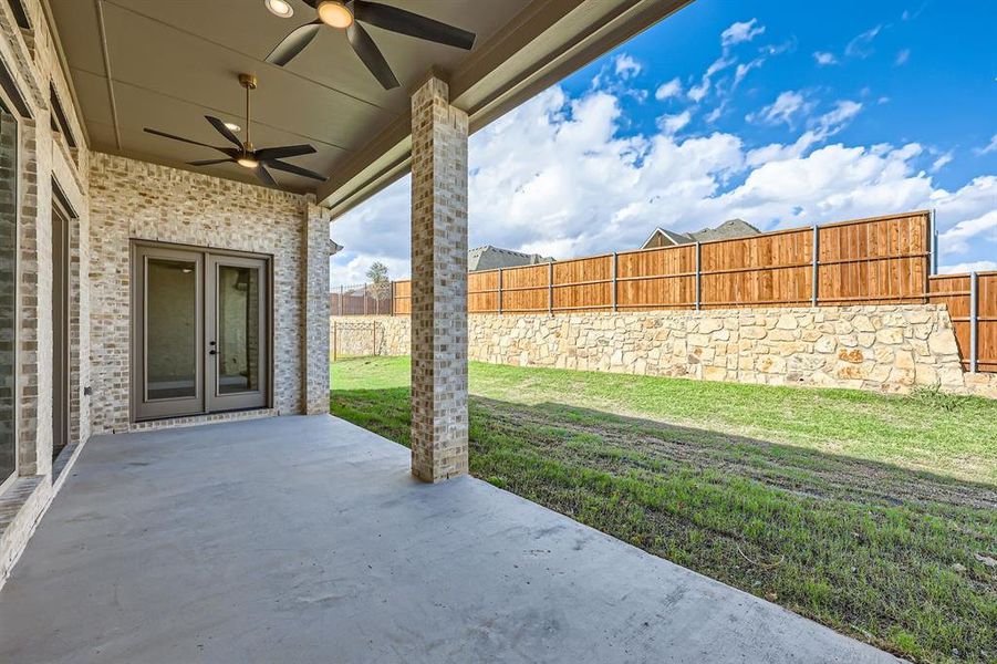 View of patio featuring ceiling fan