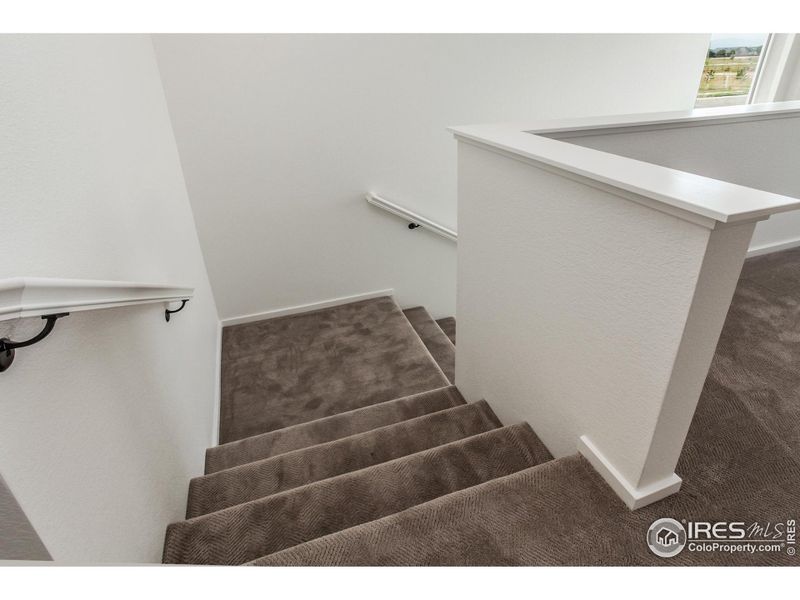 Spacious, unfurnished interior of a new home in Trailside Alley Load - Single Family Homes, Timnath (Image 24).