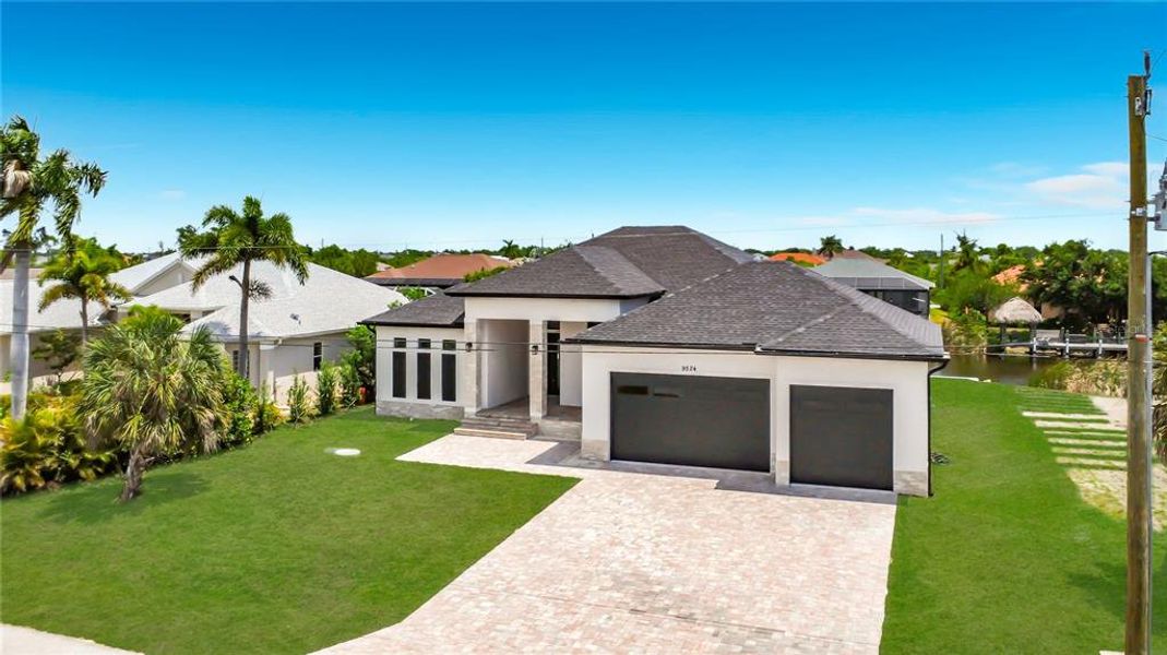 Front exterior of a new home in , Port Charlotte, FL, highlighting curb appeal (Image 23).