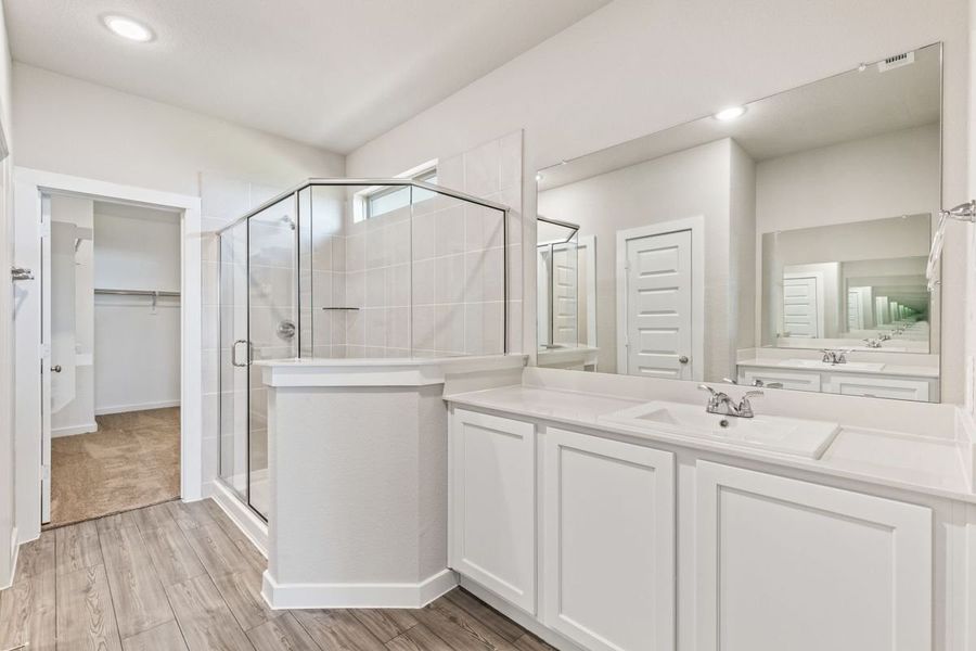 Primary Bathroom in the Willow home plan by Trophy Signature Homes – REPRESENTATIVE PHOTO