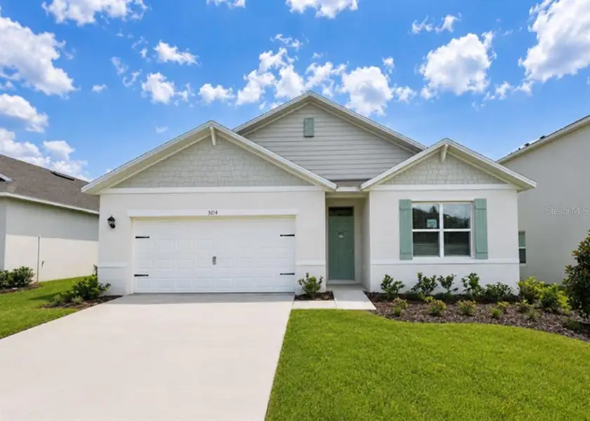 Front exterior of a new home in Buena Lago, St. Cloud, FL, highlighting curb appeal (Image 2). Front exterior of a new home in Buena Lago, St. Cloud, FL, highlighting curb appeal (Image 2).