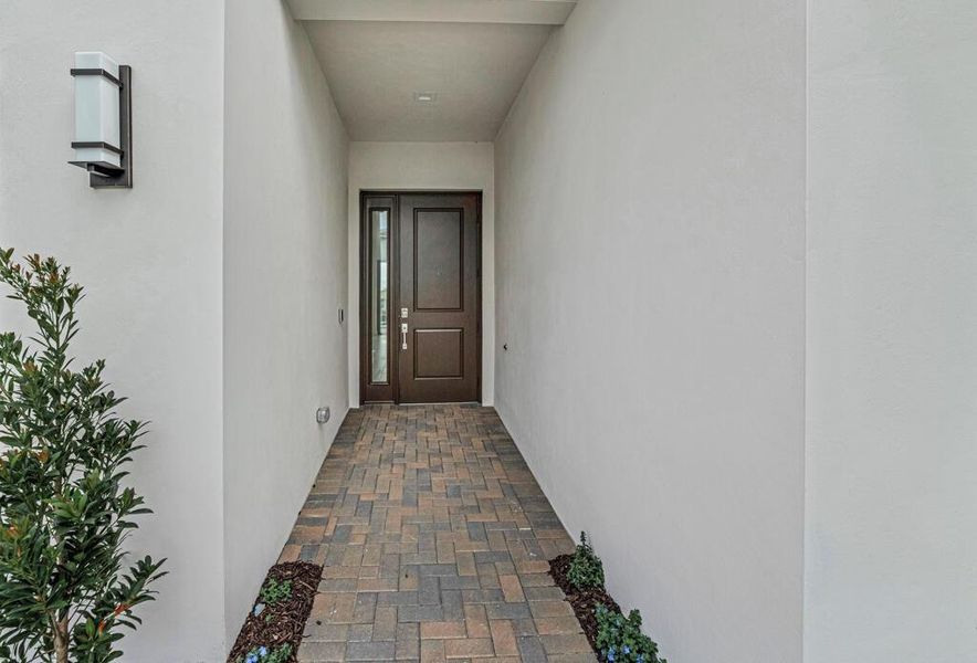 Exterior details and patio area of a home in Apex at Avenir, Palm Beach Gardens (Image 32).
