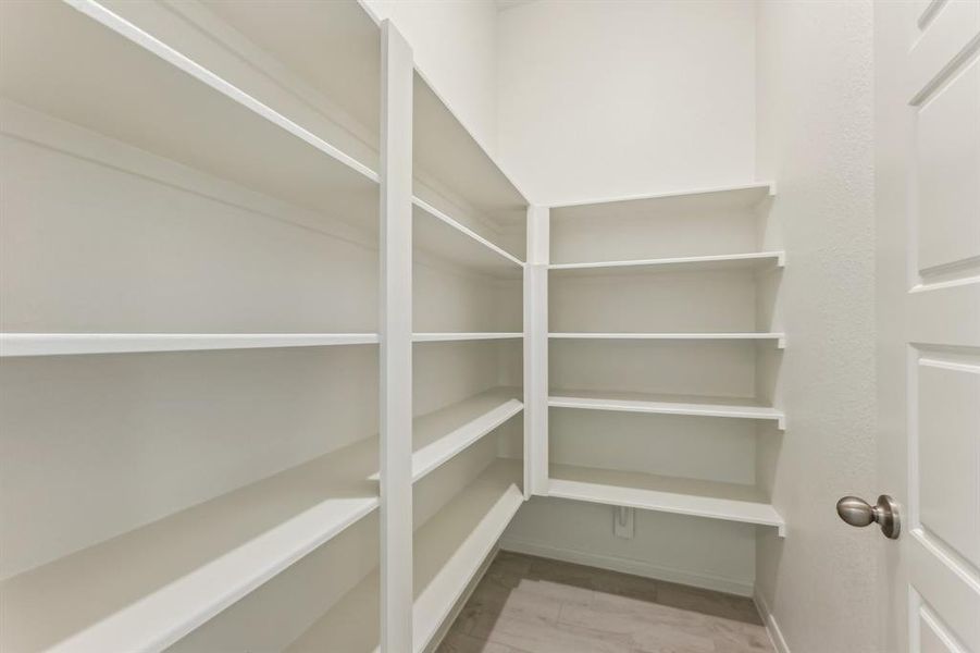 Step into this roomy, organized pantry and say goodbye to clutter and confusion!