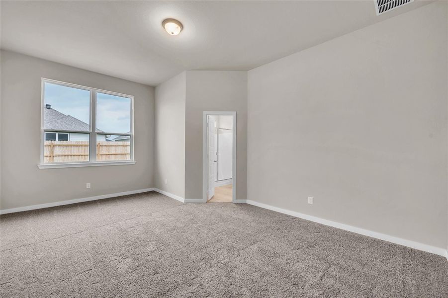 Empty room with carpet floors and baseboards
