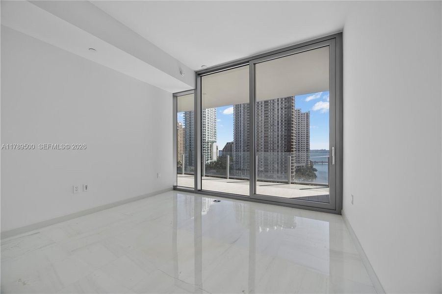 Spacious, unfurnished interior of a new home in Aston Martin Residences, Miami (Image 25).