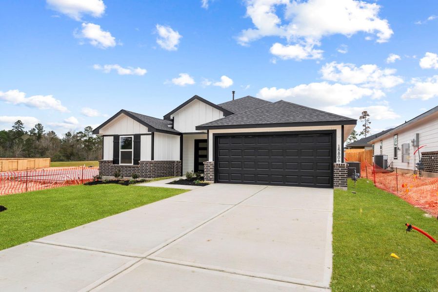 Front exterior of a new home in Chapel Lakes, Montgomery, TX, highlighting curb appeal (Image 23).