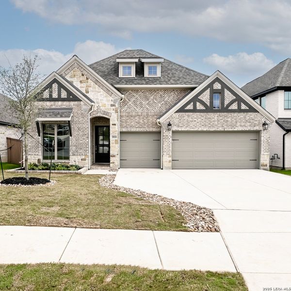 Front exterior of a new home in Johnson Ranch, Bulverde, TX, highlighting curb appeal (Image 22).