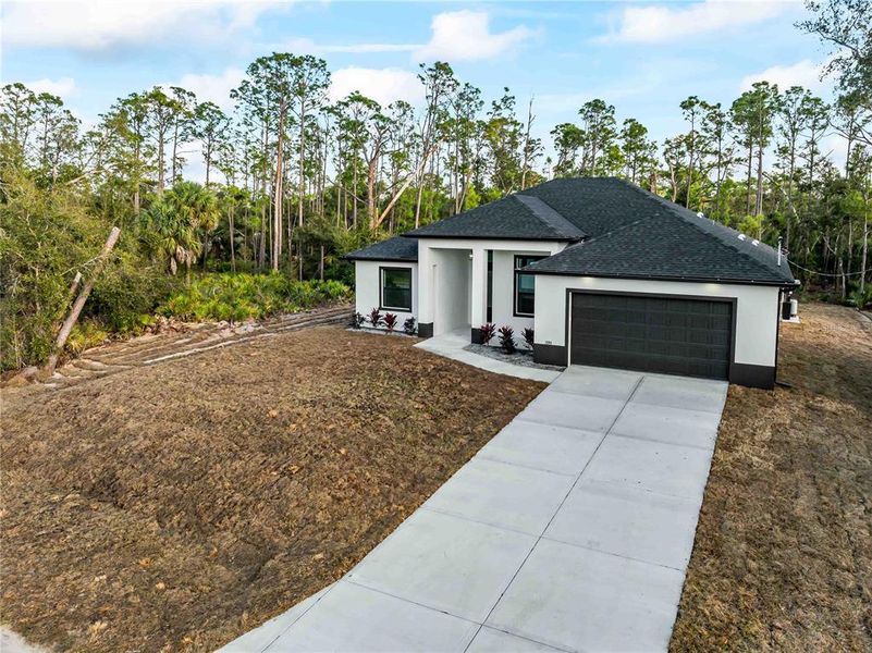 Front exterior of a new home in , Port Charlotte, FL, highlighting curb appeal (Image 30).