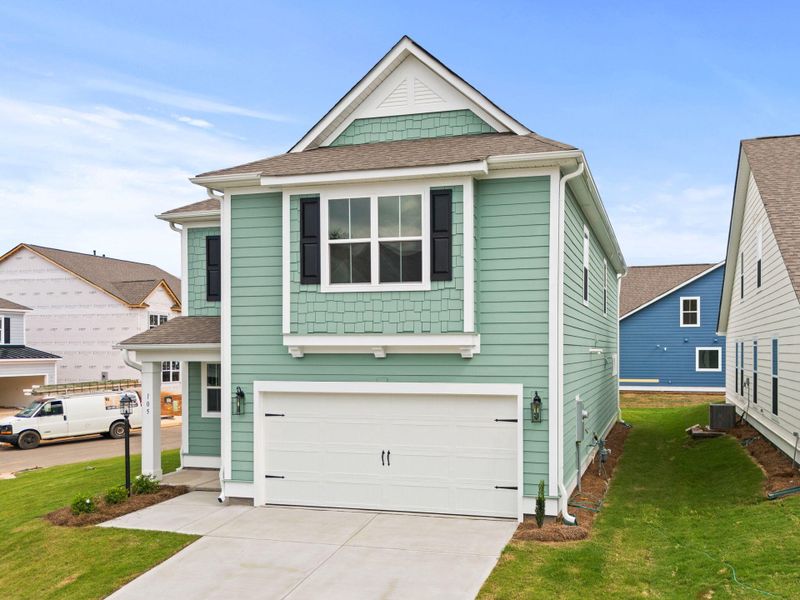 Front exterior of a new home in Sweetgrass Station, Summerville, SC, highlighting curb appeal (Image 1). Front exterior of a new home in Sweetgrass Station, Summerville, SC, highlighting curb appeal (Image 1).