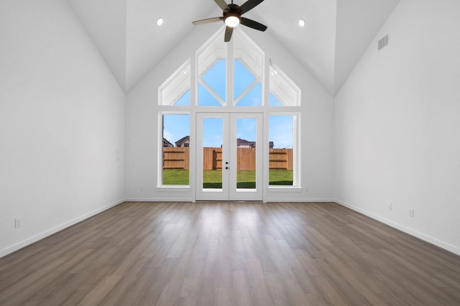 High ceilings with double doors that lead to the covered patio.