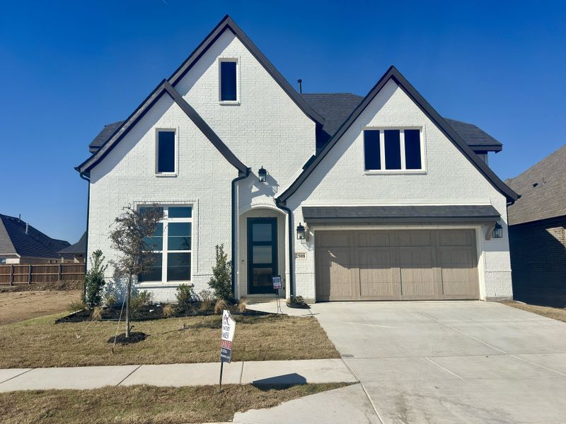 Front exterior of a new home in Lakes of River Trails, Fort Worth, TX, highlighting curb appeal (Image 1). Front exterior of a new home in Lakes of River Trails, Fort Worth, TX, highlighting curb appeal (Image 1).