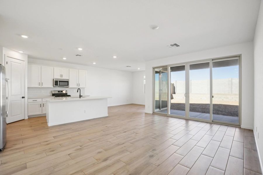 Great room, kitchen and dining. Not actual home, finishes may vary by community. Great room, kitchen and dining. Not actual home, finishes may vary by community.