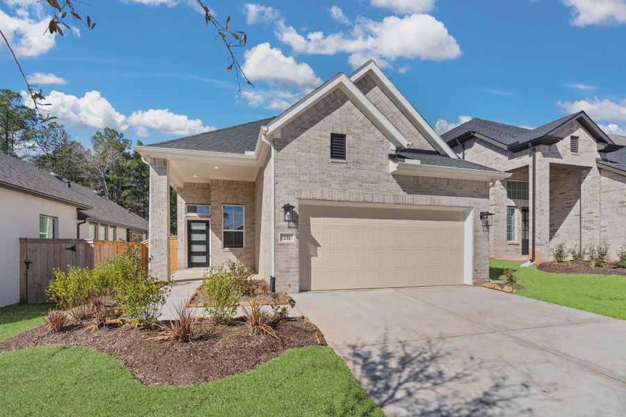 Representative exterior photo of a completed home built from the Berkley by Chesmar Homes in The Woodlands Hills, Willis, TX (Image 1). Representative exterior photo of a completed home built from the Berkley by Chesmar Homes in The Woodlands Hills, Willis, TX (Image 1).