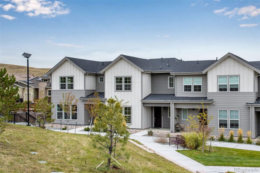 Front exterior of a new home in , Arvada, CO, highlighting curb appeal (Image 1). Front exterior of a new home in , Arvada, CO, highlighting curb appeal (Image 1).