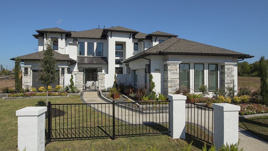 Front exterior of a new home in Sienna, Missouri City, TX, highlighting curb appeal (Image 2). Front exterior of a new home in Sienna, Missouri City, TX, highlighting curb appeal (Image 2).