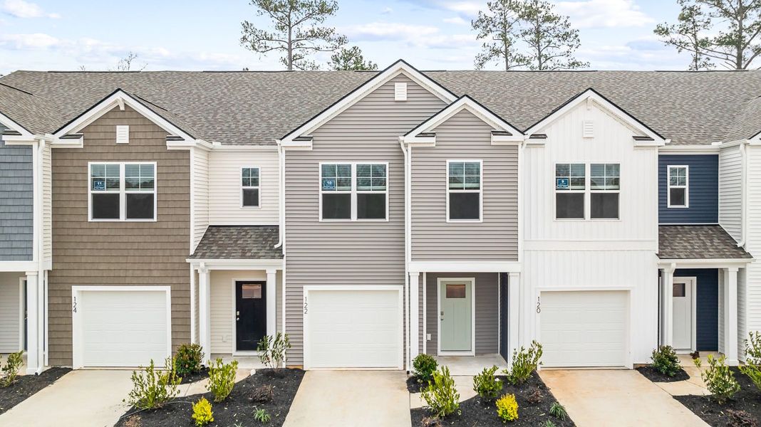 Front exterior of a new home in Marion Village, Santee, SC, highlighting curb appeal (Image 1). Front exterior of a new home in Marion Village, Santee, SC, highlighting curb appeal (Image 1).
