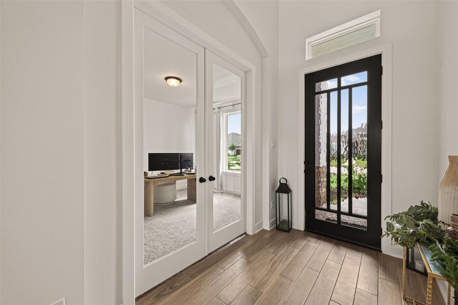 The grand front door creates a beautiful first impression as you enter the home. The grand front door creates a beautiful first impression as you enter the home.