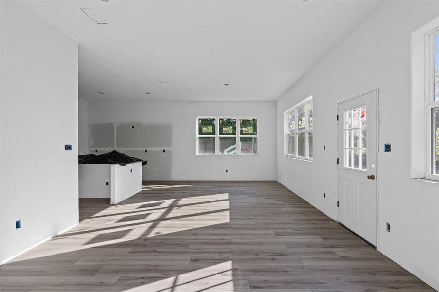 Unfurnished living room with wood finished floors Unfurnished living room with wood finished floors