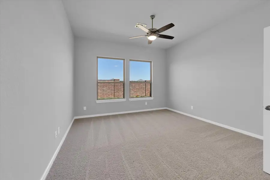 Spacious, unfurnished interior of a new home in Sunterra 40, Katy (Image 27).