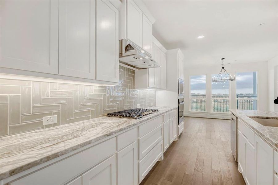 White shaker cabinetry with under-cabinet lighting