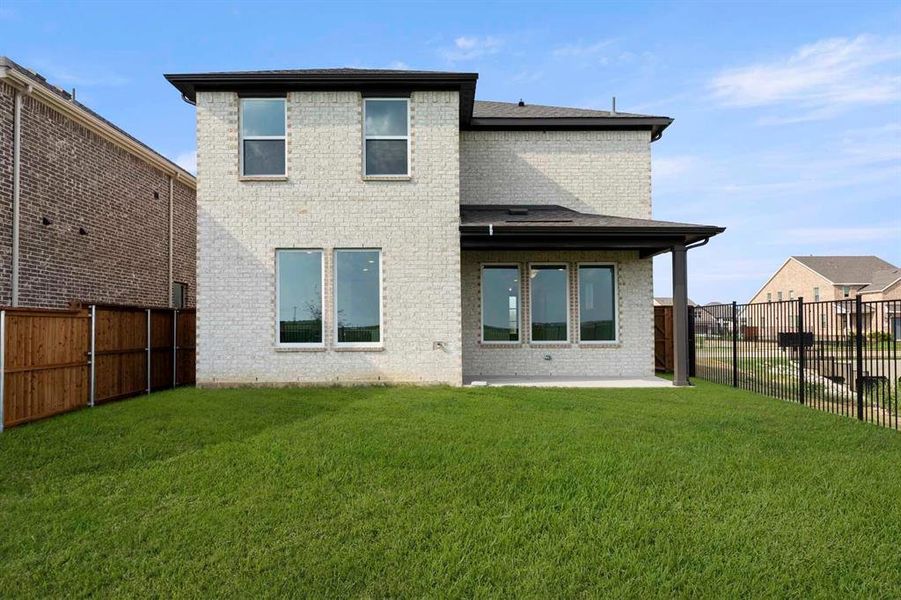 Front exterior of a new home in Creekview Fossil Ridge, Pilot Point, TX, highlighting curb appeal (Image 2).