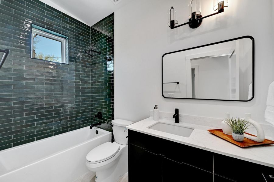 Full bathroom with shower / washtub combination, toilet, and vanity