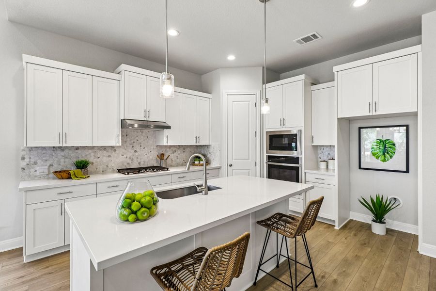 Representative furnished interior of a home built from the Hamilton by Risewell Homes in 6 Creeks, Kyle (Image 4).