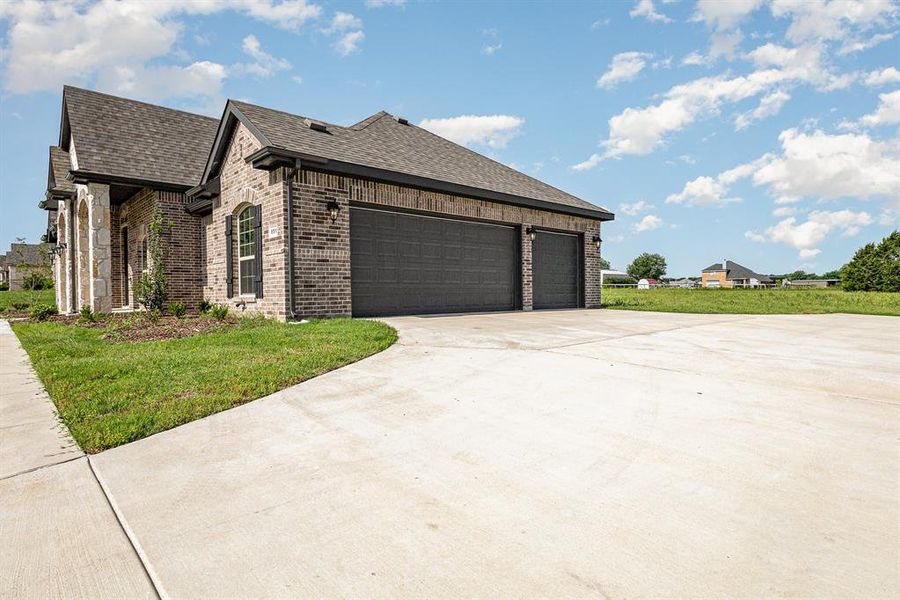 Front exterior of a new home in , Waxahachie, TX, highlighting curb appeal (Image 16).