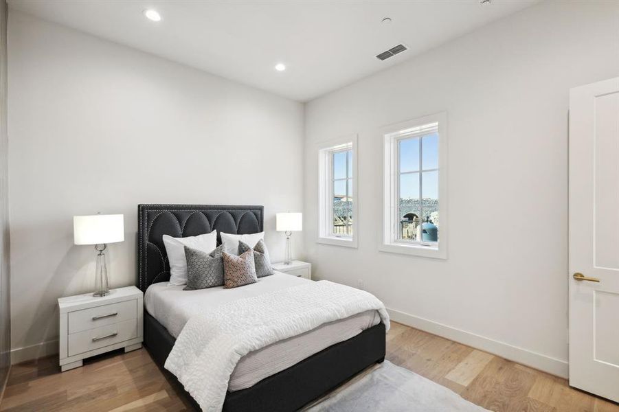 Bedroom with light hardwood / wood-style floors