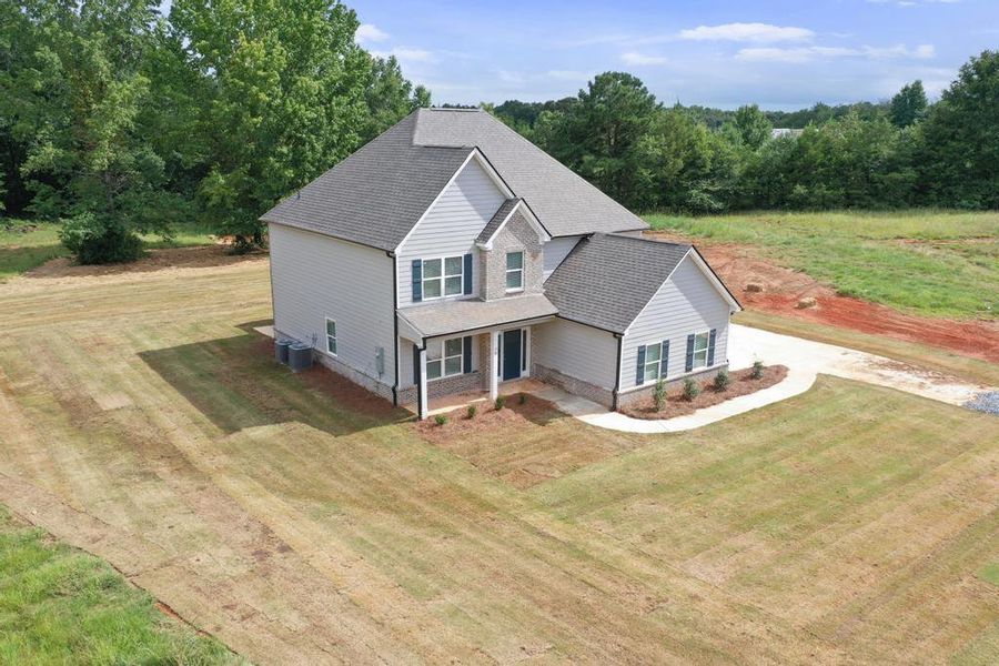 Front exterior of a new home in , McDonough, GA, highlighting curb appeal (Image 2).