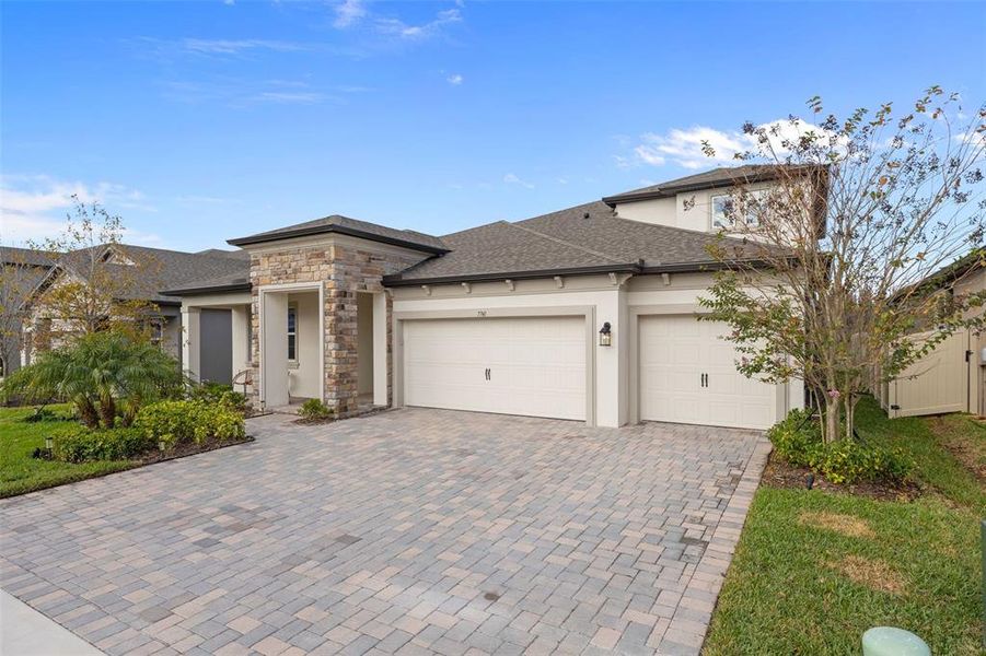 Front exterior of a new home in , Wesley Chapel, FL, highlighting curb appeal (Image 27). Front exterior of a new home in , Wesley Chapel, FL, highlighting curb appeal (Image 27).
