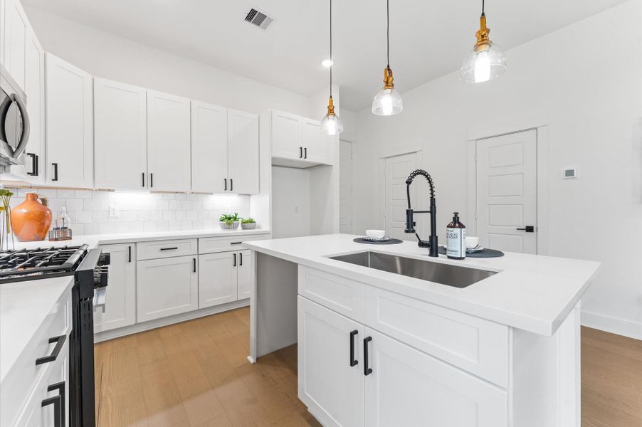 At the heart of this open-concept kitchen lies a stunning oversized island, offering generous prep space, sleek quartz countertops, and seating area. Whether you're hosting a dinner party or enjoying a casual breakfast, this island is the perfect gathering spot. Pendant lighting adds a touch of elegance, while built-in storage and a deep sink make it as functional as it is beautiful. At the heart of this open-concept kitchen lies a stunning oversized island, offering generous prep space, sleek quartz countertops, and seating area. Whether you're hosting a dinner party or enjoying a casual breakfast, this island is the perfect gathering spot. Pendant lighting adds a touch of elegance, while built-in storage and a deep sink make it as functional as it is beautiful.