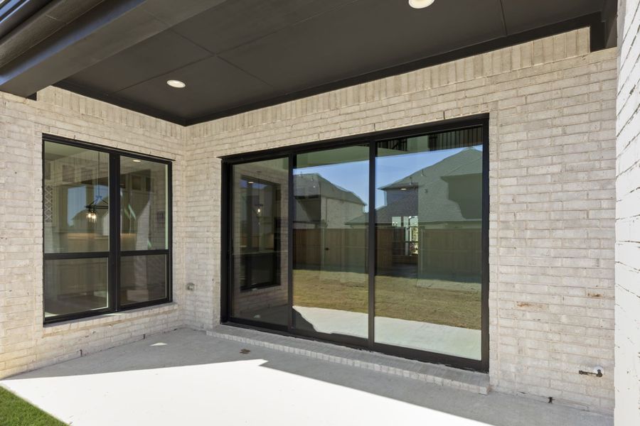 Exterior details and patio area of a home in Estates at Rockhill, Frisco (Image 4).