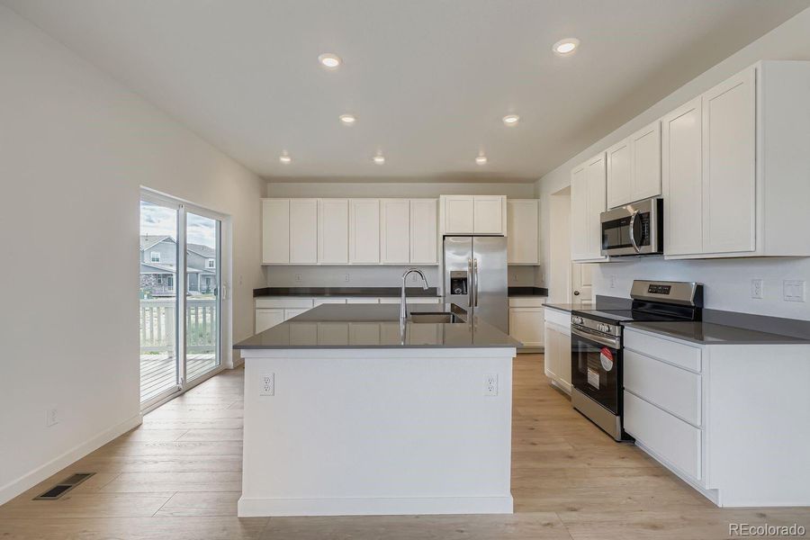 Furnished interior view inside a new home in Sky Ranch: Pioneer Collection, Watkins (Image 4).