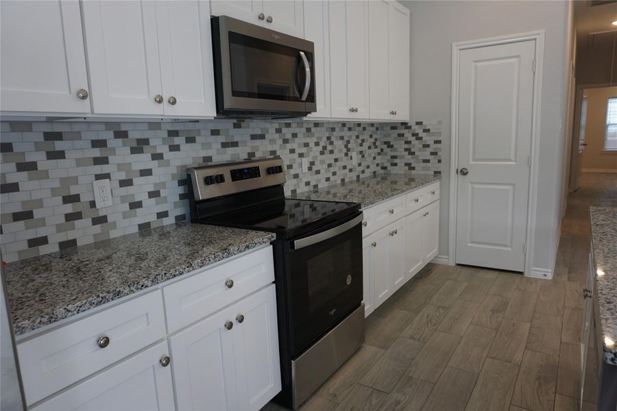 Furnished interior view inside a new home in , Willis (Image 10).