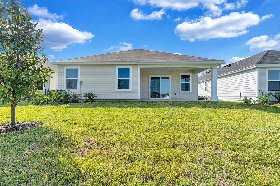 Exterior details and patio area of a home in Whiteview Village, Palm Coast (Image 2).