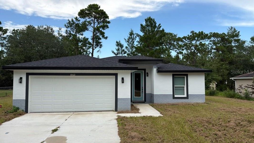 Front exterior of a new home in , Dunnellon, FL, highlighting curb appeal (Image 11). Front exterior of a new home in , Dunnellon, FL, highlighting curb appeal (Image 11).
