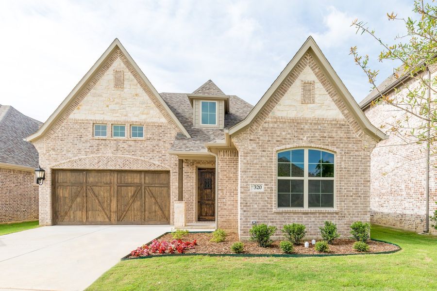 Representative exterior photo of a completed home built from the The Michie by West Point Homes in Riverdance, Keller, TX (Image 1). Representative exterior photo of a completed home built from the The Michie by West Point Homes in Riverdance, Keller, TX (Image 1).