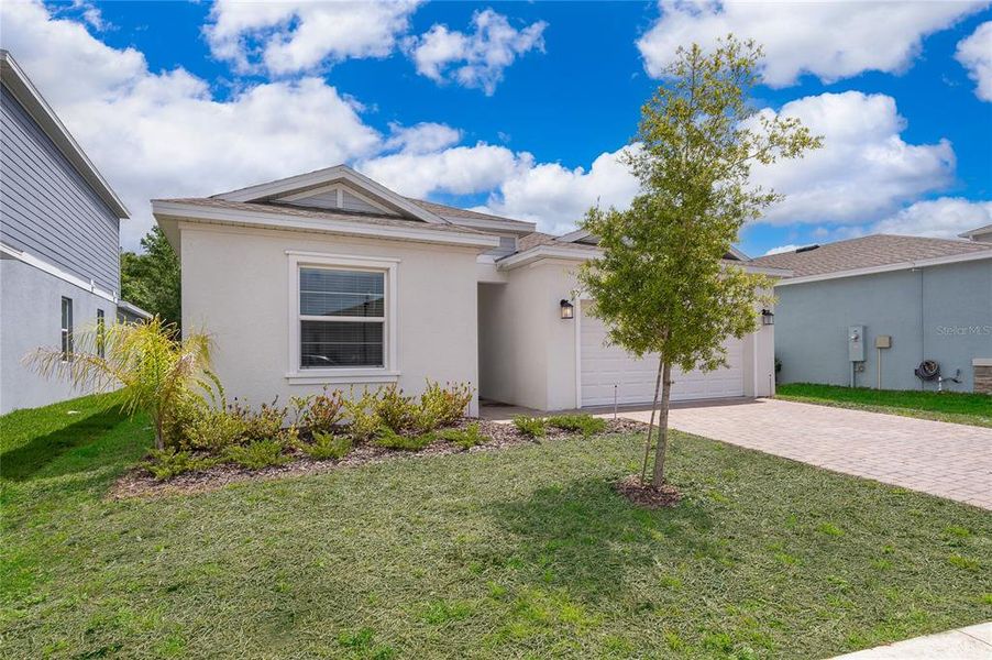 Front exterior of a new home in , Davenport, FL, highlighting curb appeal (Image 23).