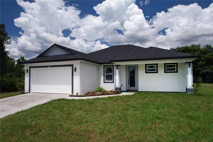 Front exterior of a new home in , North Port, FL, highlighting curb appeal (Image 21).